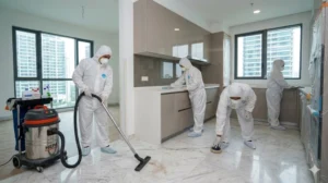 professional post renovation cleaning team in ppe working in a newly renovated condominium
